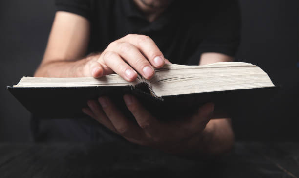istock Caucasian man holding bible. Religion 1275762674