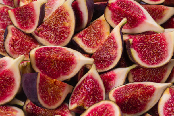 istock Tasty figs background. Top view. 1275763614