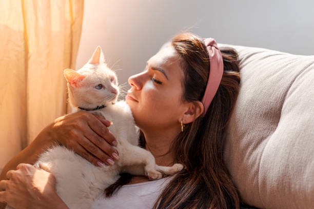 istock Woman with pet on her lap 1275763693