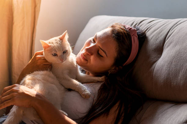 istock Woman with pet on her lap 1275763774