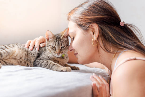 istock Young woman enjoying her time with her pet 1275765115