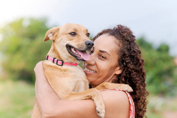 istock Woman with her dog on her lap 1275766210