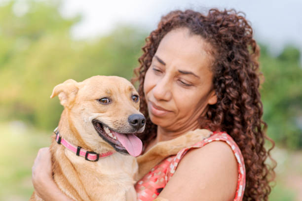 istock Lady holding her pet in her lap 1275766351