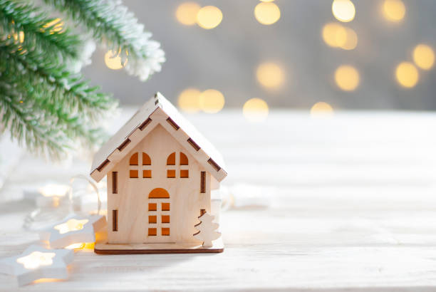 istock Toy house and christmas tree, abstract light white natural holiday background with copy space 1275770149