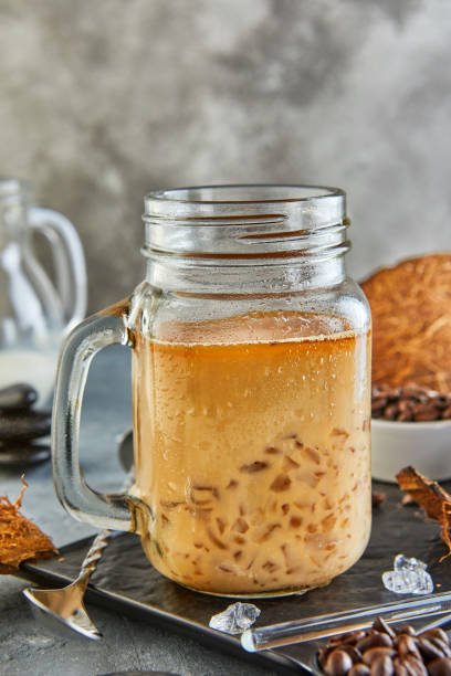 istock Thai Iced Coffee with Coconut Milk with Crushed Ice in a Mason Jar 1275772472