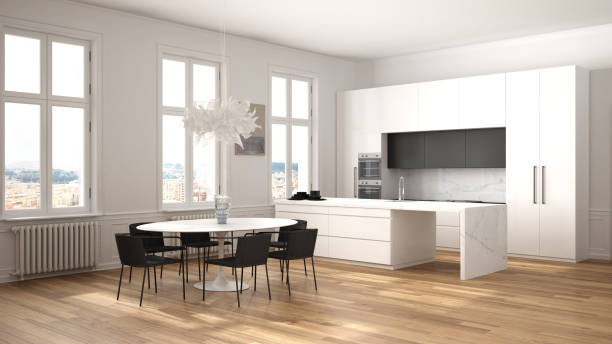 istock Minimalist white and black kitchen in classic room with moldings, parquet floor, dining table with chairs, marble island and panoramic windows. Modern architecture interior design 1275772498