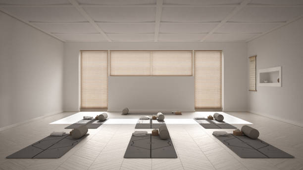 istock Empty yoga studio interior design, open space with mats, pillows and accessories, venetian bamboo blinds, herringbone parquet, big window, ready for yoga practice, meditation room 1275772525