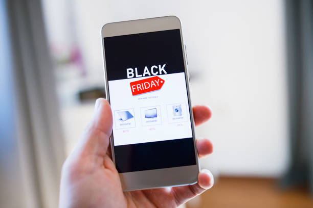 istock Buying Electronics Online Using Your Smart Phone At Black Friday Sales 1275773252