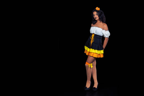 One person of aged 30-39 years old who is beautiful with ponytail african ethnicity female business person standing in front of white background in the office wearing costume and high heels and wearing wearing dinosaur mask mask