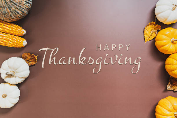 istock Happy Thanksgiving Day with pumpkin and nut on the table 1275776231