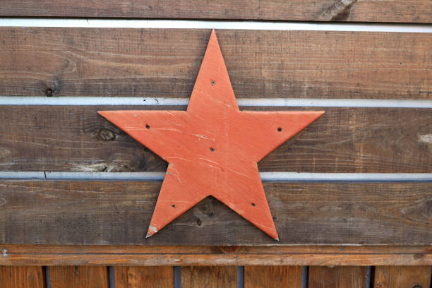 istock Red star on wooden wall 1275776234
