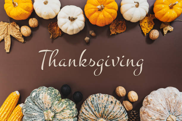 istock Happy Thanksgiving Day with pumpkin and nut on the table 1275776765