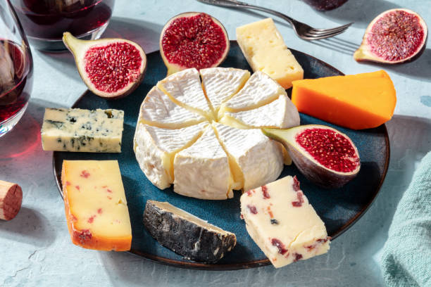 istock Cheese platter with wine and figs, close-up shot 1275780571