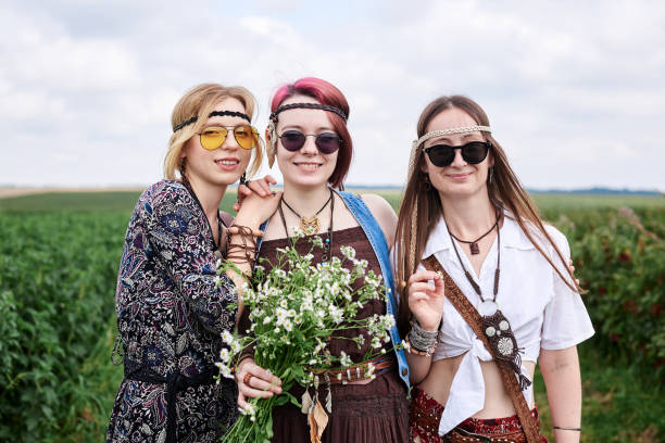 istock Hippie women relaxin on field 1275780838