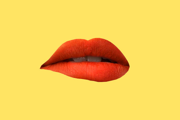 istock Woman's lips close up isolated on yellow background 1275782275