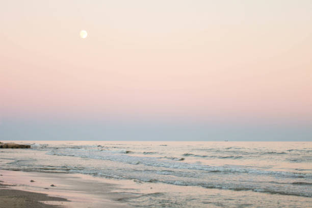 istock Full moon over the evening sea 1275782683