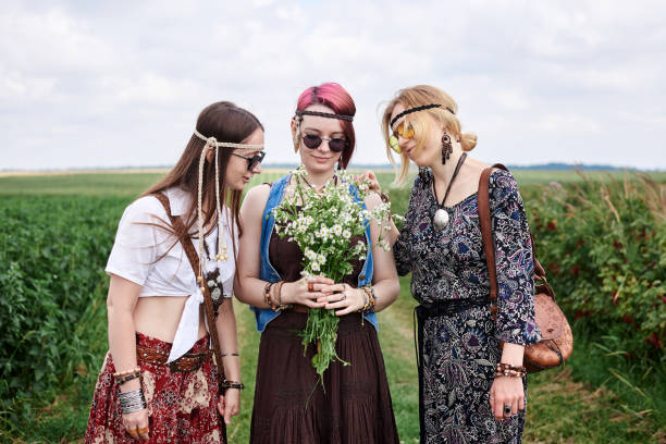 istock Hippie women relaxin on field 1275782807