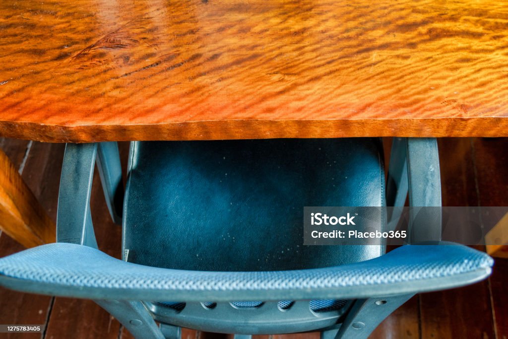 Wood desk table with chair and copy space top view A rustic wooden empty desk with an office chair underneath.  High angle top view looking down with copy space. Above Stock Photo