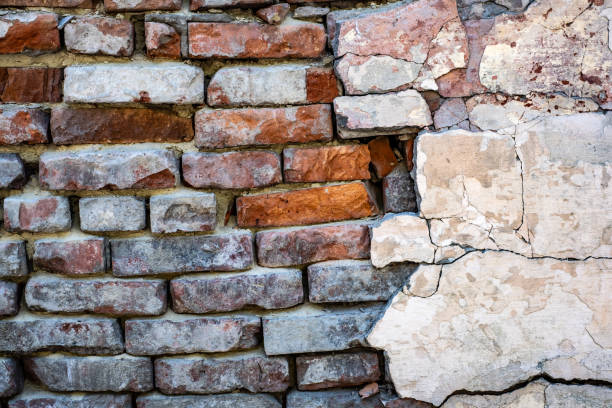 istock Background of old dirty brick wall 1275783501