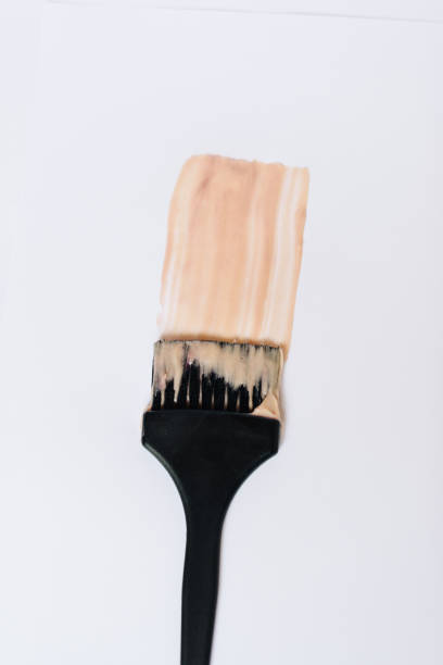 istock Black brush with hair dye on a white background 1275785757