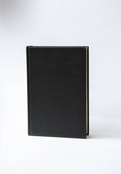 istock Black hardcover book on white background 1275786969