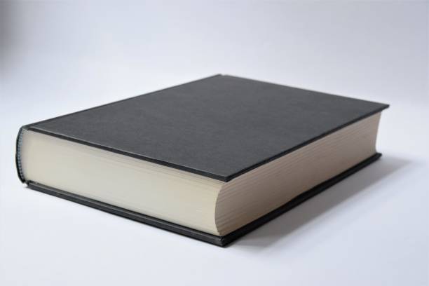 istock Black hardcover book on white background 1275787092