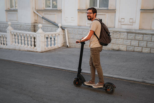 istock fun driving electric scooter through the city 1275787325