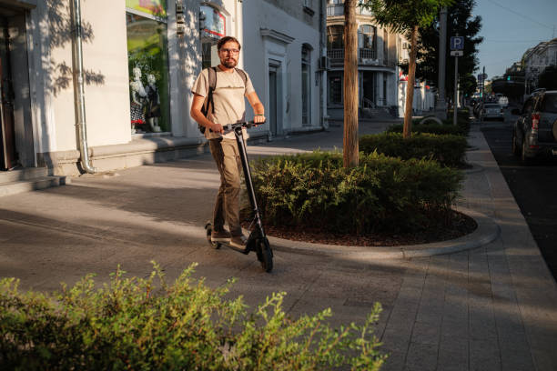 istock fun driving electric scooter through the city 1275787380