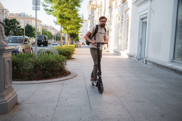 istock fun driving electric scooter through the city 1275787387