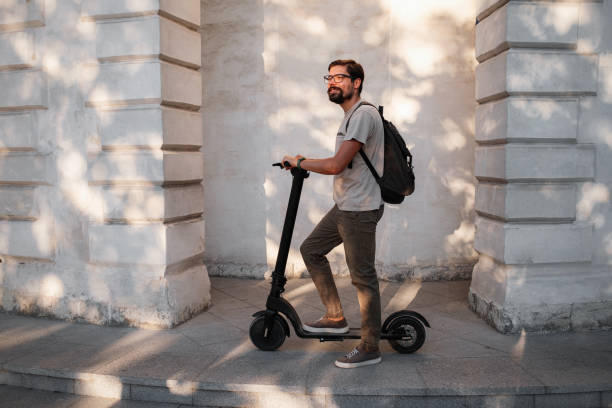 istock fun driving electric scooter through the city 1275787440
