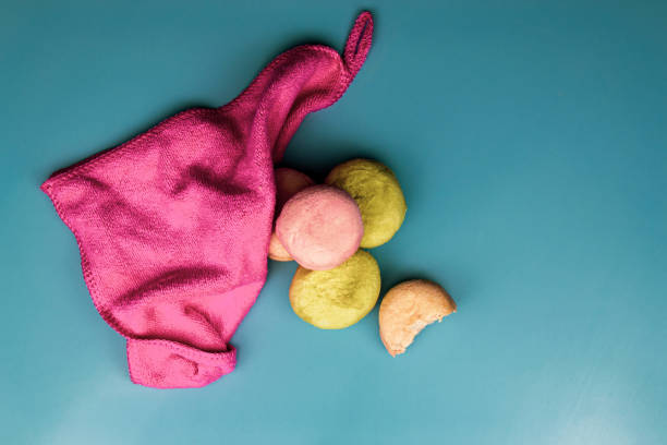 istock Macarons, pink napkin on a blue background 1275788285