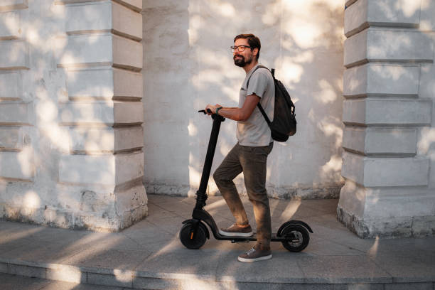 istock fun driving electric scooter through the city 1275788804