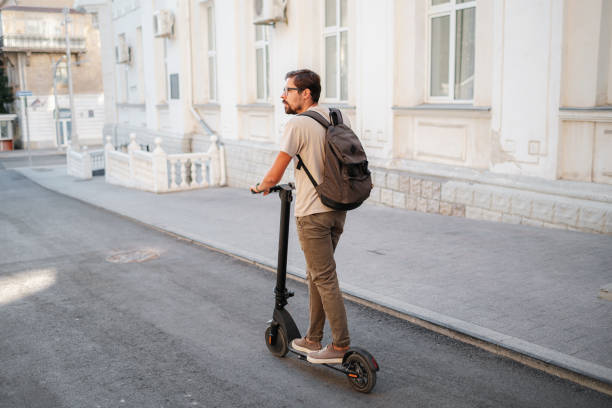 istock fun driving electric scooter through the city 1275791228