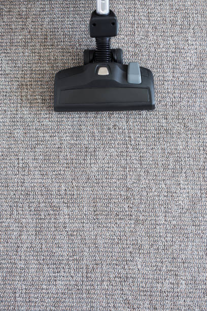 istock housekeeping concept - modern vacuum cleaner on carpet floor 1275792800