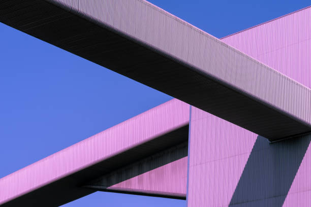 Low Angle View Of Modern Building Against Clear Blue Sky