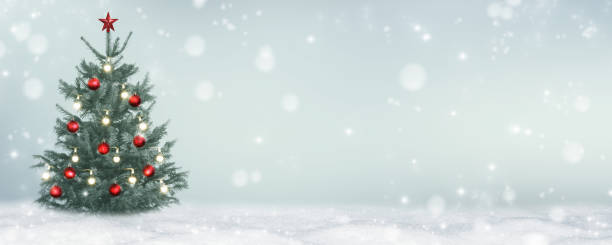 istock classical christmas tree on blurred abstract winter background, decorated with christmas balls and string light 1275793316