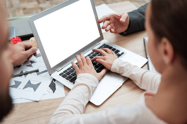 istock Girl typing while sitting at a desk in the office. 1275794582