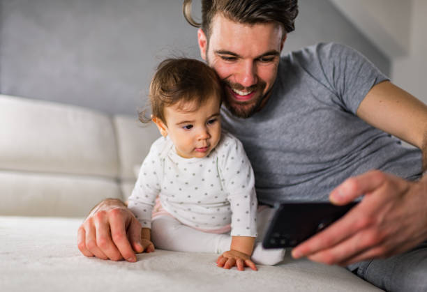 istock Beautiful father and daughter taking selfie 1275796579