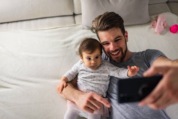 istock Beautiful father and daughter taking selfie 1275797299