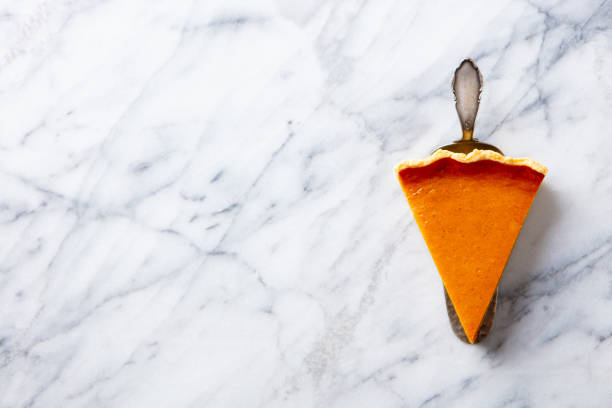 Pumpkin pie, tart. Marble background. Copy space. Top view.