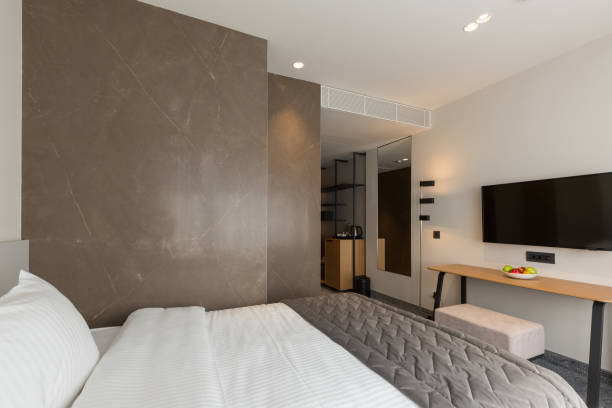 istock Interior of a luxury master bed hotel bedroom 1275799338