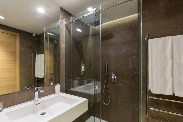 istock Interior of a hotel bathroom interior with shower cabin 1275800364