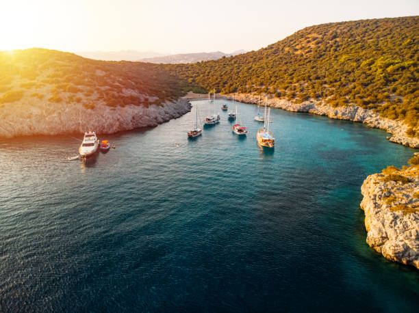 Coves and cliffs in the Mediterranean Sea. Kekova, Turkey. Yachts or boats sailing on the sea