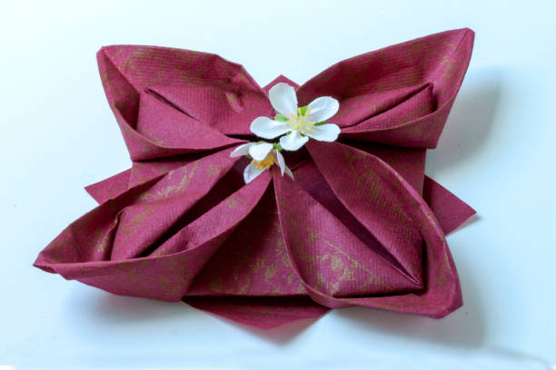 istock Paper towel folding in lotus flower on white background 1275800570