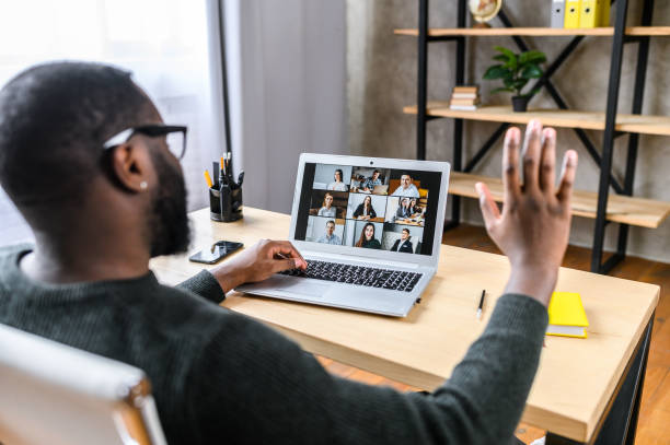 istock A guy talking online with employees via video call 1275801875