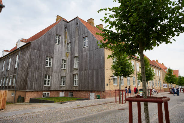 Christiansfeld is a small city based on a religious community and founded in 1773 and finished in 1806. The building contains a collection of things telling the story about the city. \nThe city is build in all yellow bricks and has a strong geometry centered around a central square with the church. Even today the city is heavily influenced by the religion.\nChristiansfeld is on UNESCO World Heritage list.
