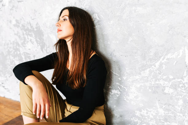istock Beautiful brunette woman in suit. Studio shot 1275802329