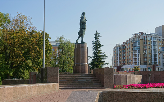 Tambov, Russia. September 15, 2020.Monument to Zoya Kosmodemyanskaya, view with Kazan Cathedral in Tambov. Russia. Located Near the Kazan Monastery The monument was created in 1947, sculptor M.G. Manizer, architect I.G. Langbard.