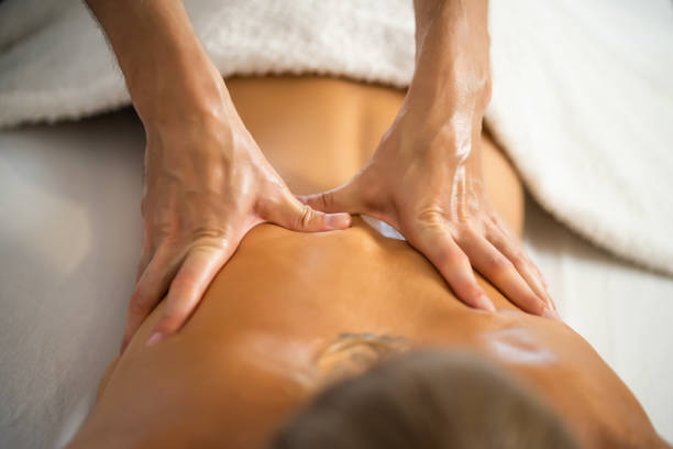 istock Woman getting massage at home 1275802998