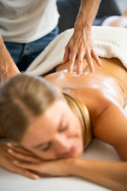 istock Woman getting massage at home 1275803180